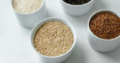 close up of variety of rice in bowls