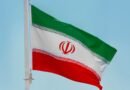 iran national flag under blue sky