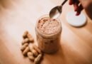 teaspoon over peanut butter in glass jar