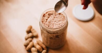 teaspoon over peanut butter in glass jar