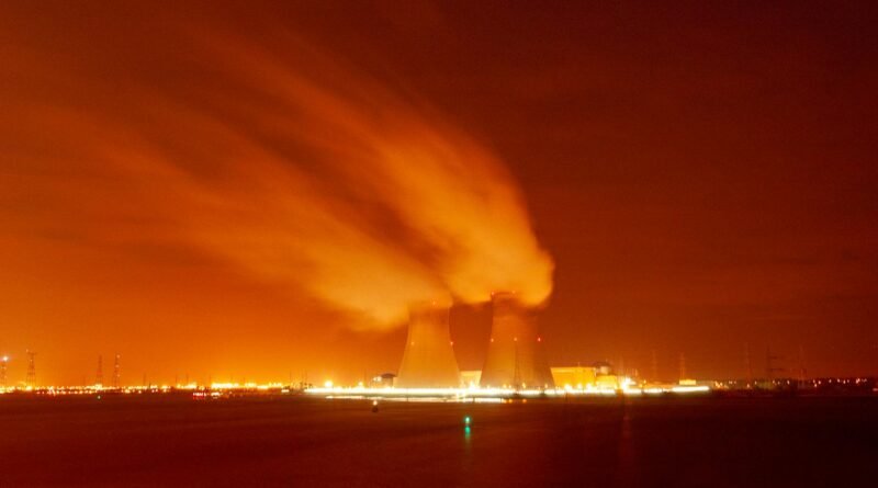 nuclear power plant cooling towers at night