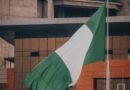 nigerian flag waving in urban environment