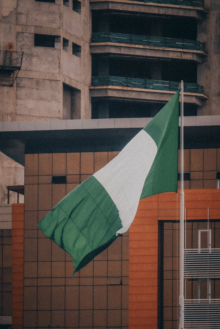 nigerian flag waving in urban environment