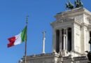 vittoriano monument in rome with italian flag