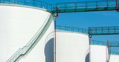 industrial storage tanks with walkway above