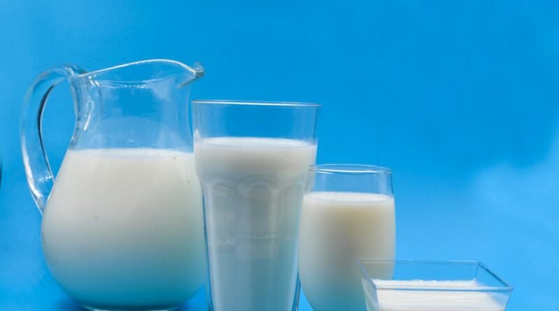 glasses of milk on a blue surface