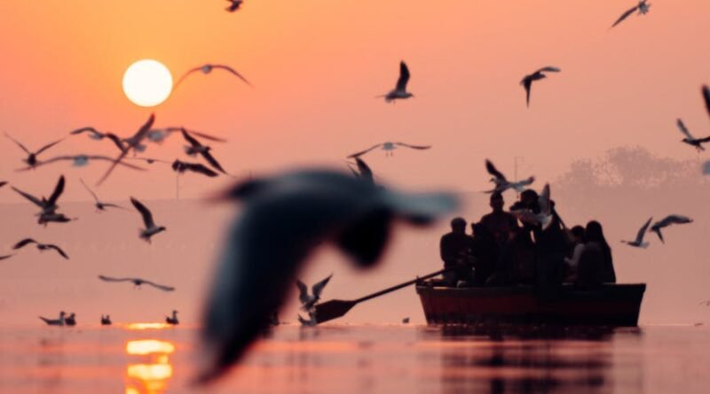 people on boat during sunset