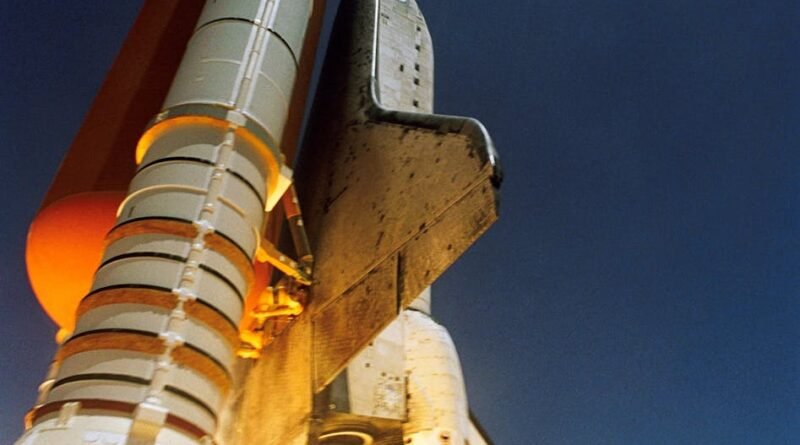 white spaceship blast off during daytime