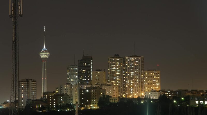 night skyline of tehran featuring milad tower