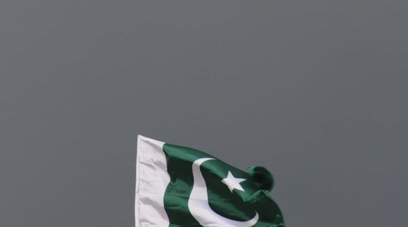 pakistani flag against stormy sky
