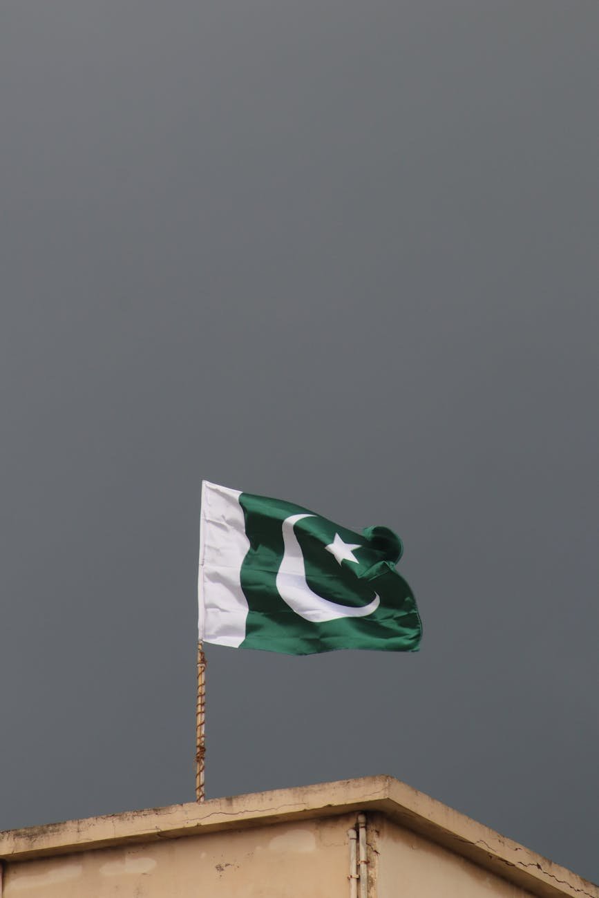 pakistani flag against stormy sky