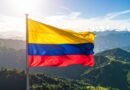colombian flag flies over andean landscape