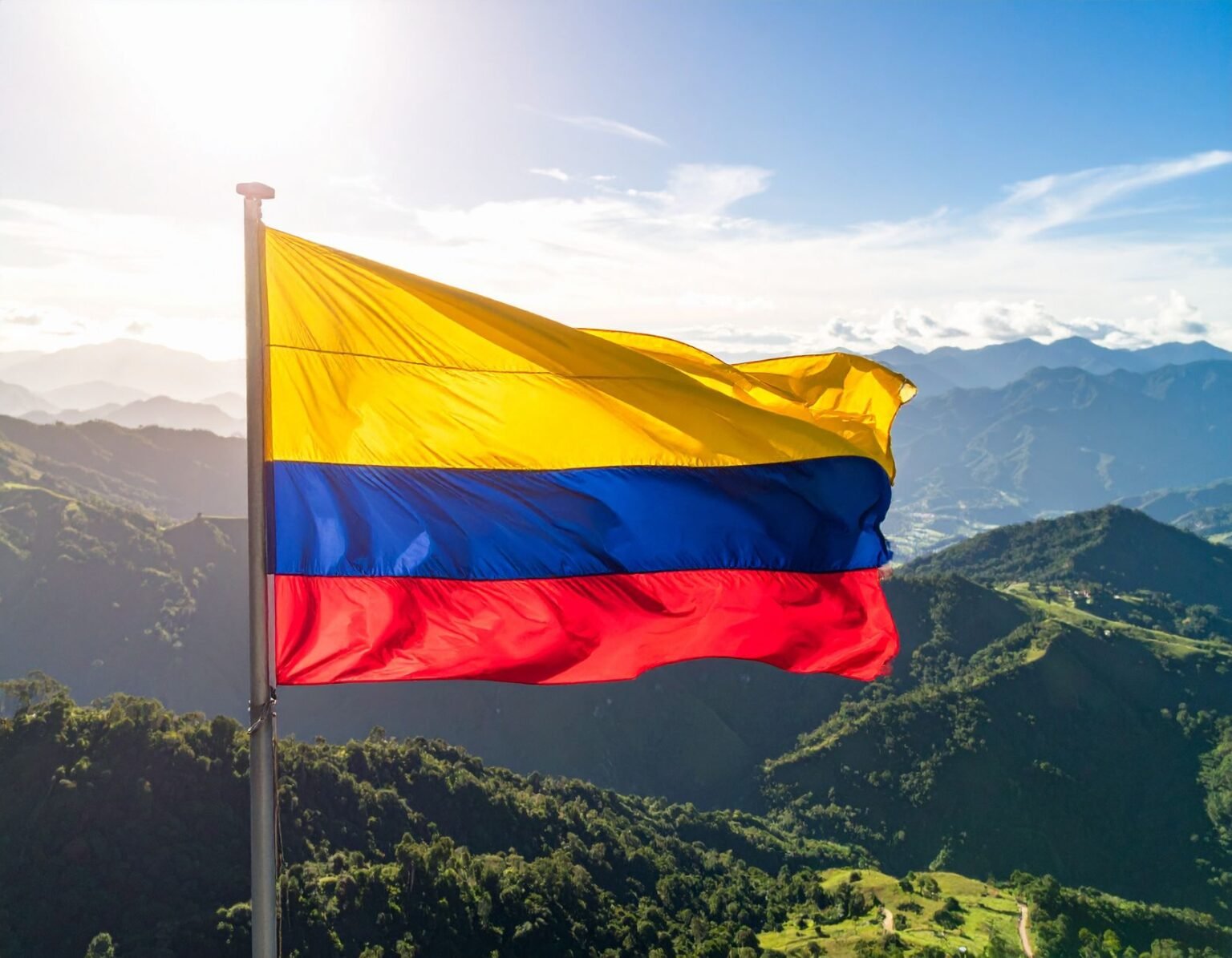 colombian flag flies over andean landscape