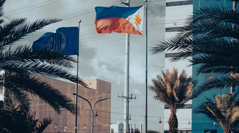 philippine and sm flags in urban setting