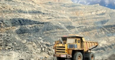 At least 82 Killed in Massive Coal Mine Gas Explosion in Northern China a construction truck in a barren landscape
