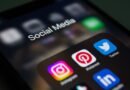 close up of a smartphone screen displaying social media app folder