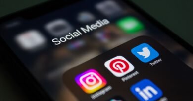 Britain Unveils Sweeping Social Media Ban for Under-16s, Going Further Than Any Other Country close up of a smartphone screen displaying social media app folder
