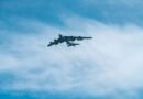 military airplane flying on sky