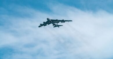 military airplane flying on sky
