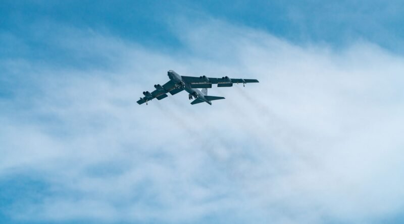 military airplane flying on sky