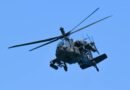 military helicopter in flight