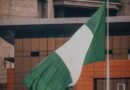 nigerian flag waving in urban environment