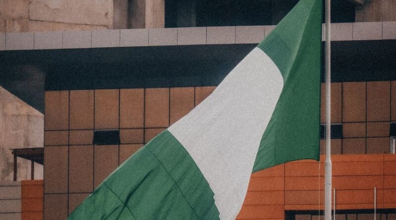 nigerian flag waving in urban environment