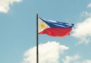 philippine flag against a bright blue sky