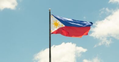 philippine flag against a bright blue sky