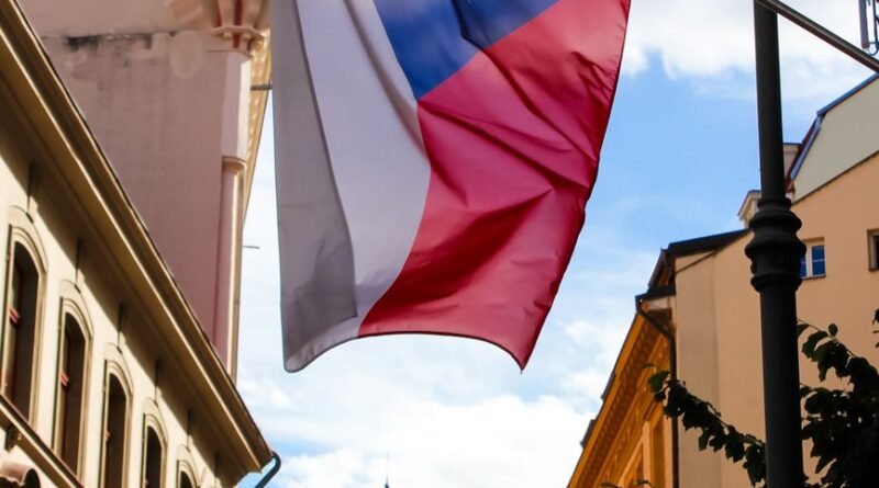 czech flag waving in prague city street scene