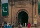 lahore fort entrance with national flags and visitors