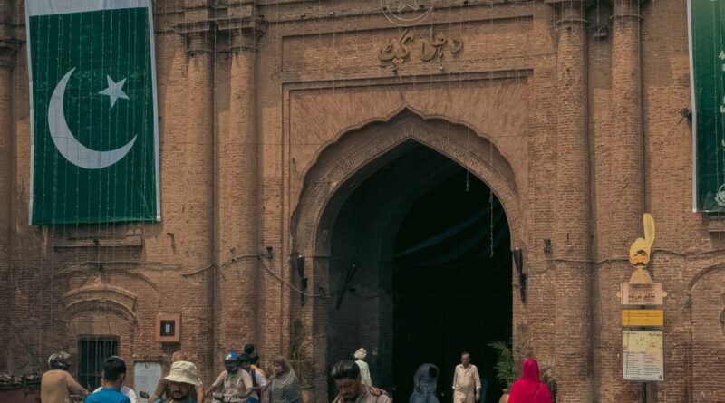 lahore fort entrance with national flags and visitors