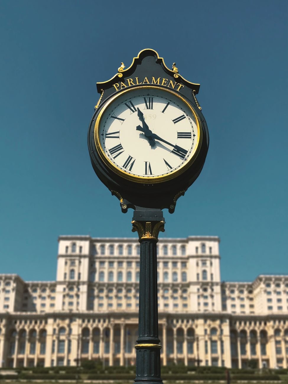the clock in front of the parliament palace bucharest romania