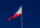 flag on flagpole against cloudless sky