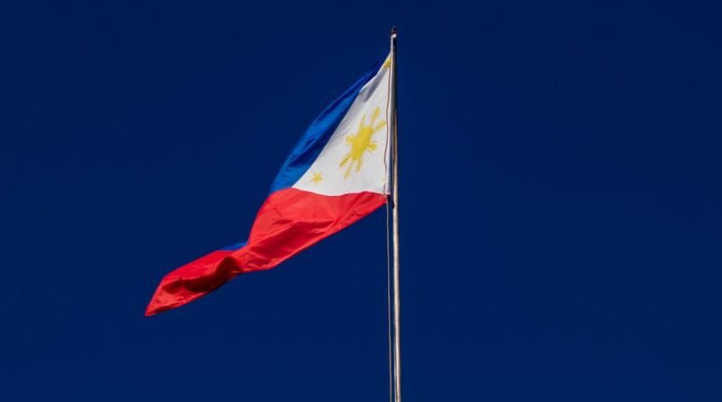 flag on flagpole against cloudless sky