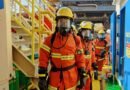 firefighters wearing uniform and gas mask