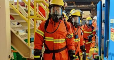 firefighters wearing uniform and gas mask
