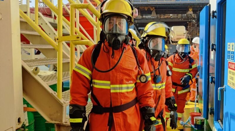 firefighters wearing uniform and gas mask