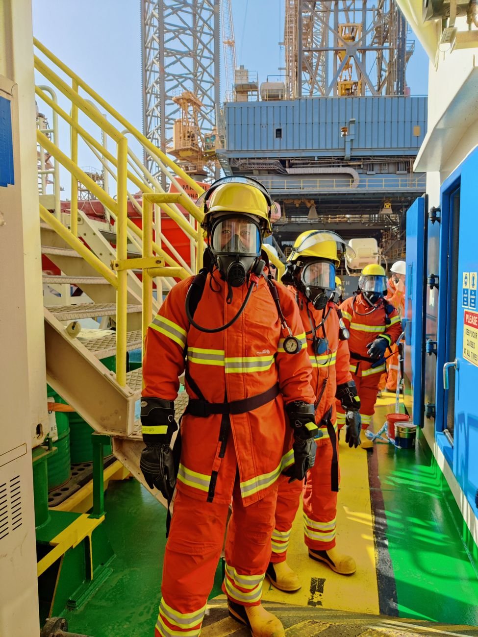 firefighters wearing uniform and gas mask