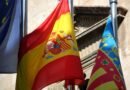 close up of flags on the background of a building