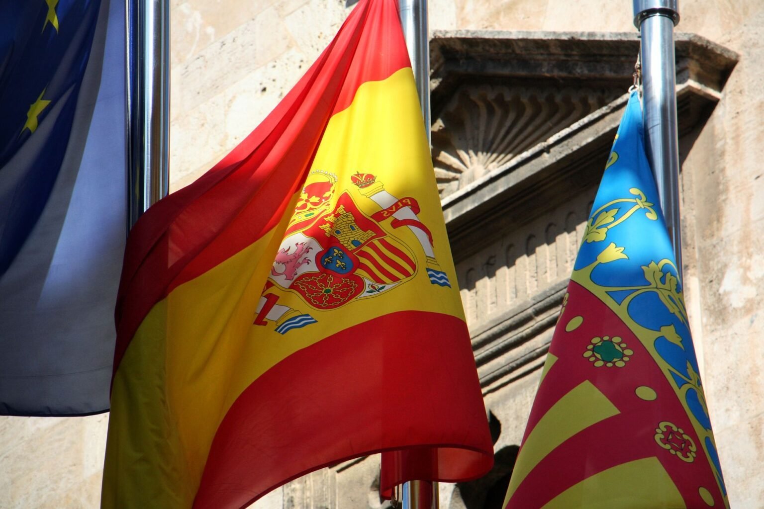 close up of flags on the background of a building