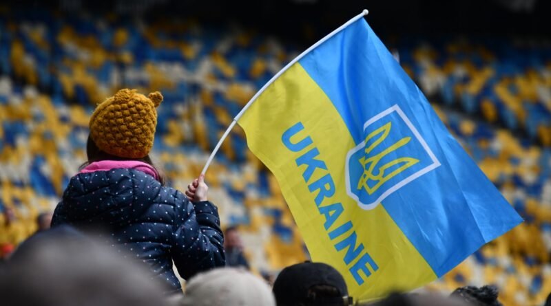 child with ukrainian flag