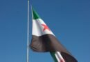 syrian flag waving against clear blue sky