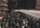 a truck spraying water on protesters
