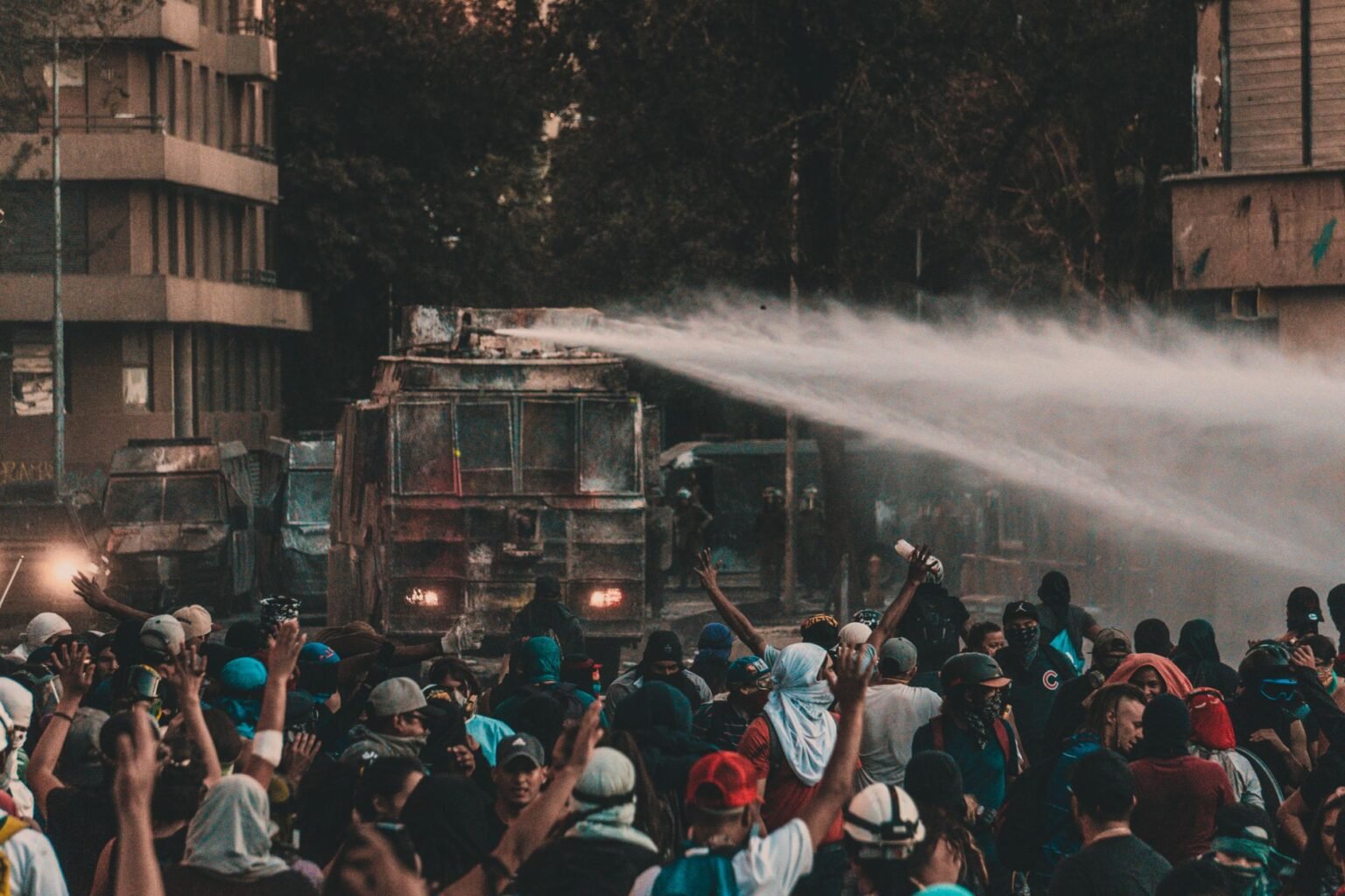 a truck spraying water on protesters