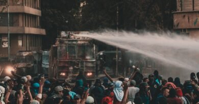 a truck spraying water on protesters