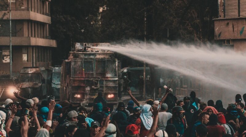 a truck spraying water on protesters