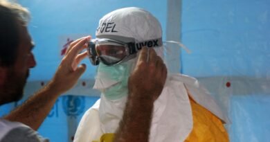 man wearing black goggles and protective suit