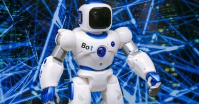 Humanoid Robot Shatters 100m Record at Beijing Robot Games white robot action figure on blue string lights