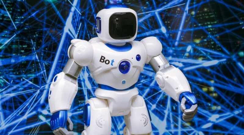 white robot action figure on blue string lights